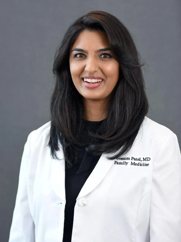 Family medicine doctor smiling.