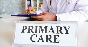 Doctor writing on paper.