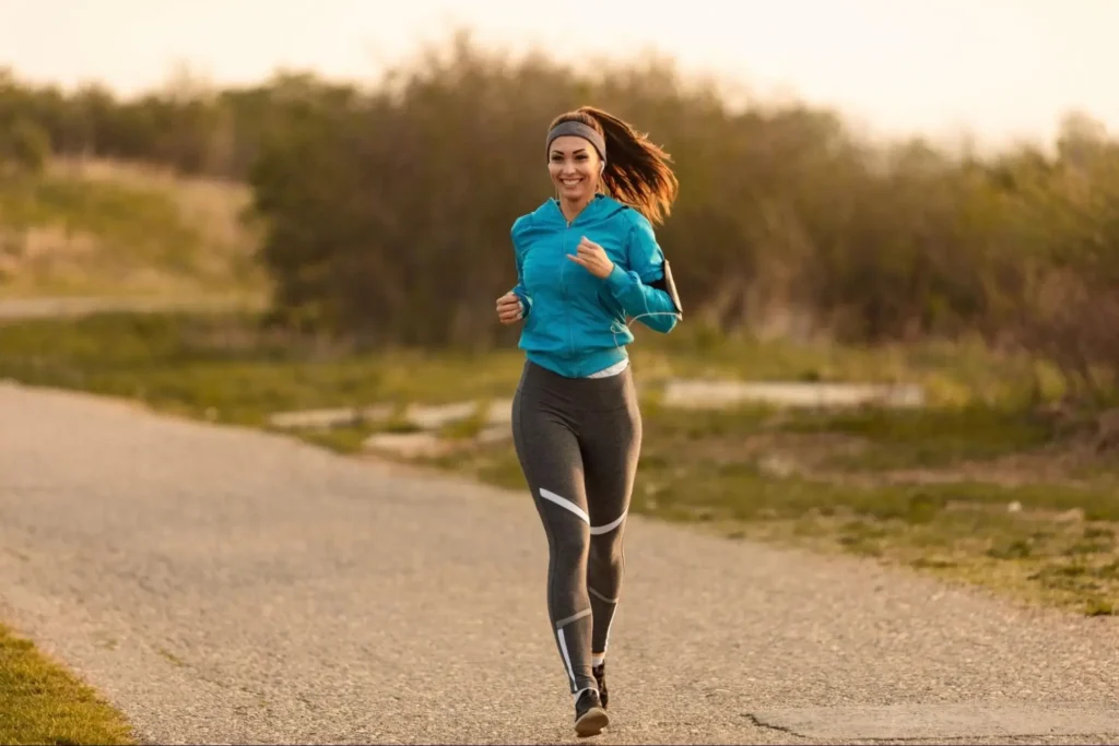 "Woman jogging outdoors in morning light"