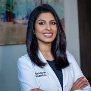 Confident female doctor smiling